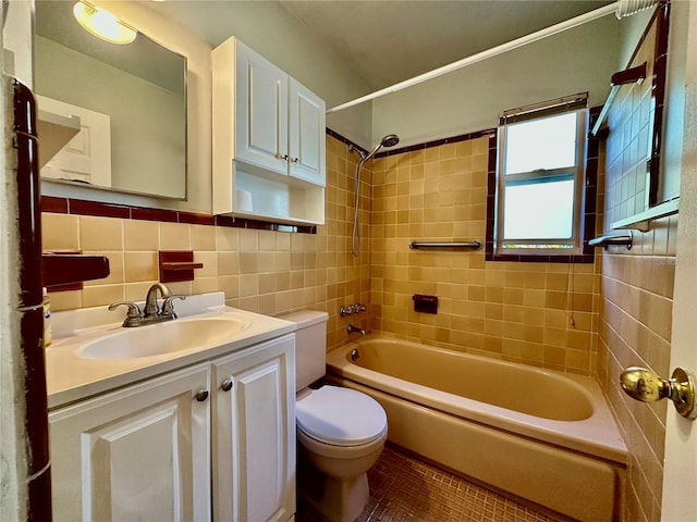 full bathroom featuring tiled shower / bath combo, tasteful backsplash, tile walls, tile patterned floors, and vanity