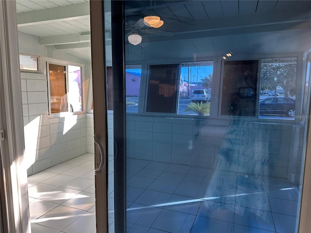 bathroom with wooden ceiling, tile patterned floors, and beam ceiling