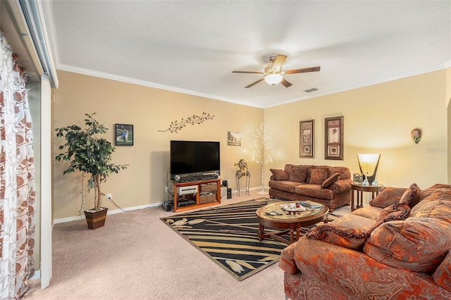 carpeted living room with ceiling fan and ornamental molding