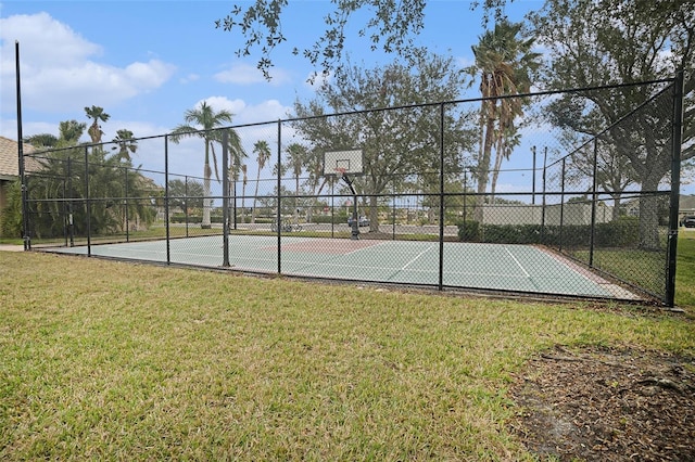 view of basketball court featuring a lawn