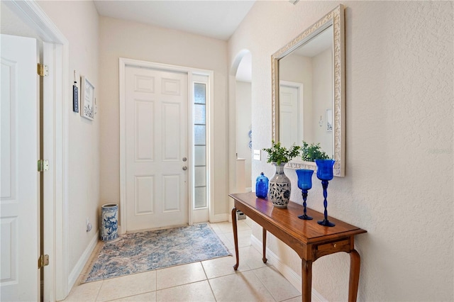 foyer featuring light tile patterned floors