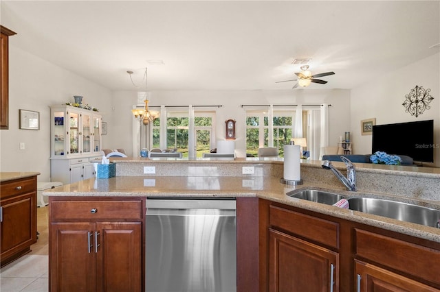 kitchen featuring sink, light tile patterned floors, dishwasher, light stone countertops, and ceiling fan with notable chandelier