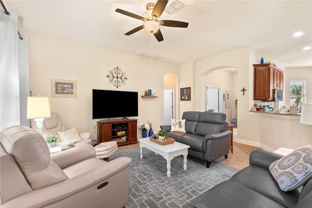 living room featuring ceiling fan and light tile patterned flooring