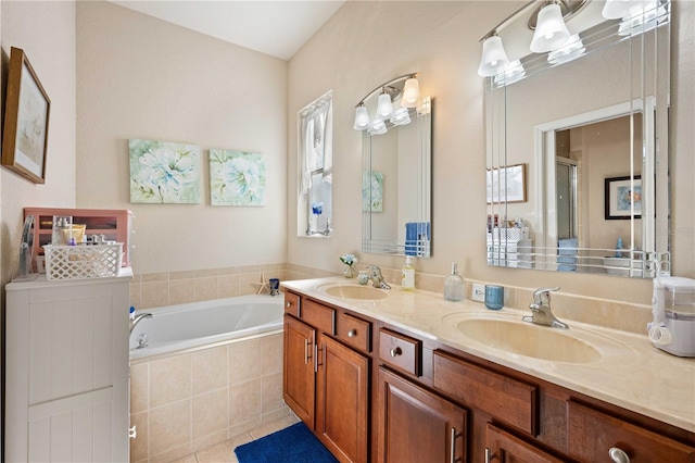 bathroom with tile patterned floors, plus walk in shower, and vanity