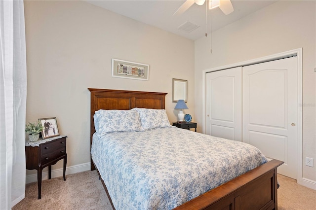 carpeted bedroom featuring a closet and ceiling fan