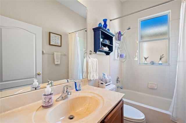 full bathroom with shower / tub combo with curtain, vanity, and toilet