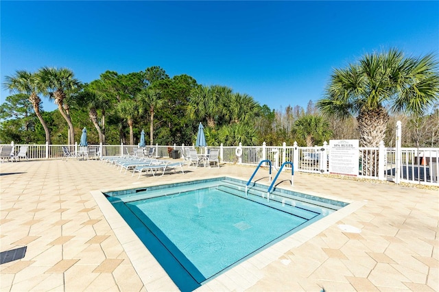 view of swimming pool featuring a patio