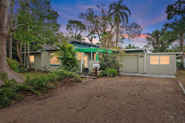 view of back house at dusk