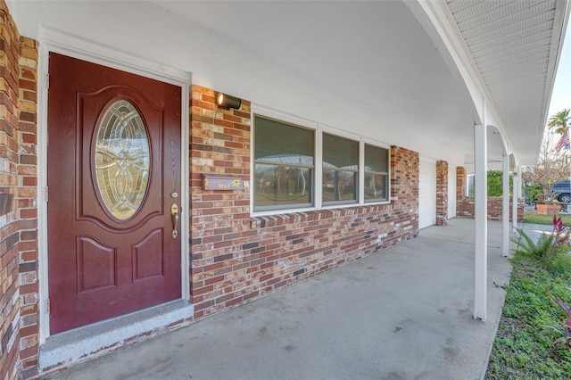 doorway to property featuring a porch