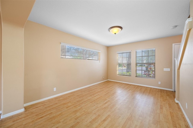 unfurnished room featuring light hardwood / wood-style flooring