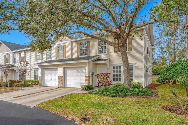 view of front facade featuring a front yard and a garage