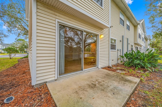 entrance to property with a patio