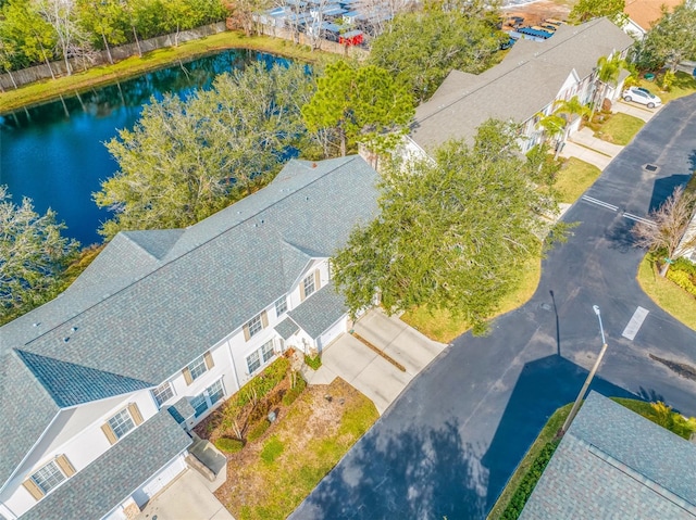 birds eye view of property featuring a water view