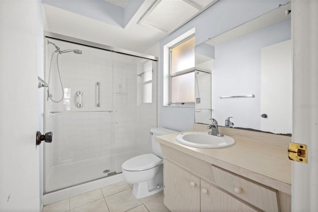 bathroom with toilet, tile patterned floors, walk in shower, and vanity