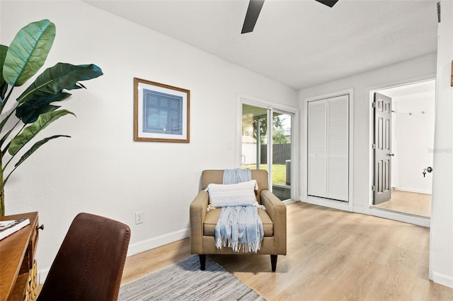 sitting room with ceiling fan and light hardwood / wood-style floors