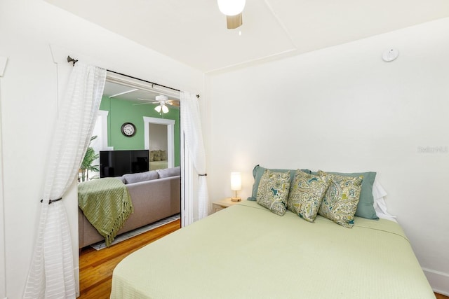 bedroom featuring ceiling fan and hardwood / wood-style flooring