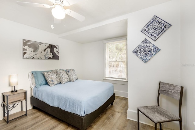 bedroom featuring ceiling fan and light hardwood / wood-style floors