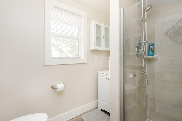 bathroom featuring toilet and walk in shower