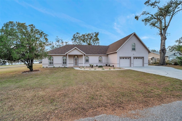 view of front facade with a front yard and a garage