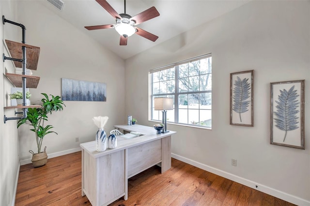 office area featuring light wood-type flooring, ceiling fan, and vaulted ceiling