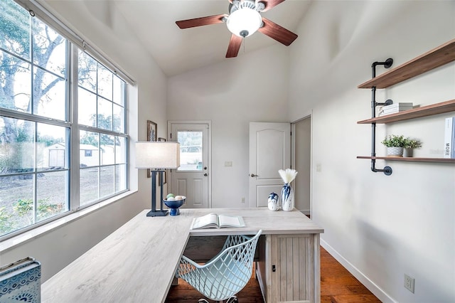 office with vaulted ceiling, ceiling fan, plenty of natural light, and dark hardwood / wood-style floors