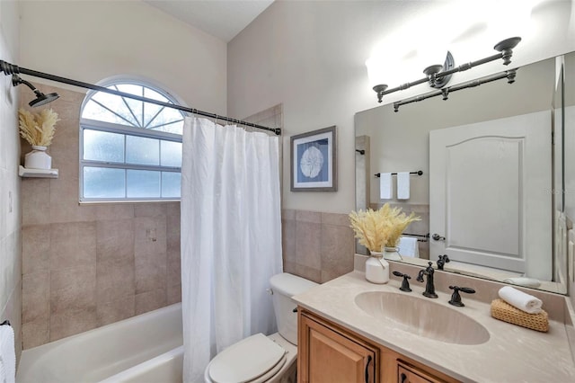 full bathroom with toilet, vanity, and shower / bath combination with curtain