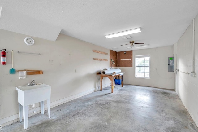 garage with ceiling fan and electric panel