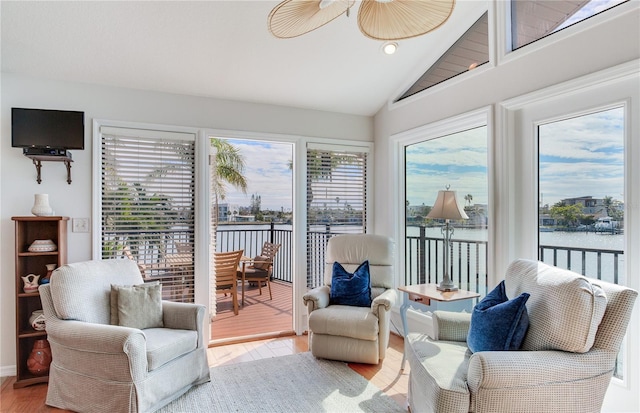 interior space featuring lofted ceiling and a water view