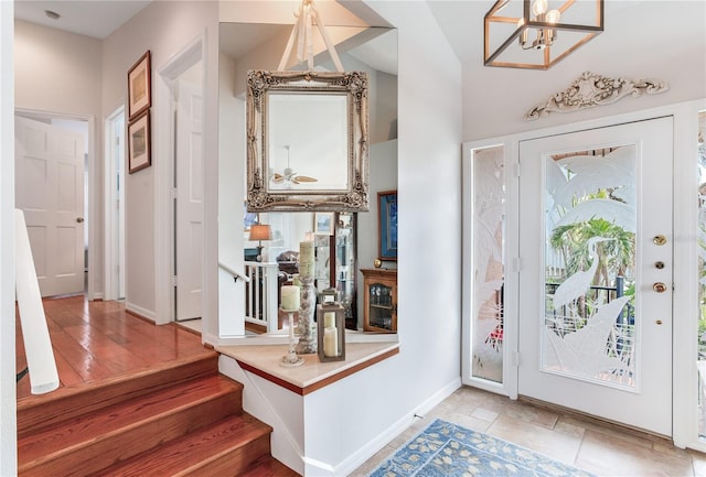 entryway featuring a notable chandelier