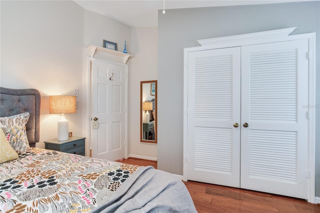 bedroom featuring light wood-type flooring and a closet