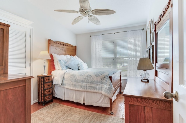 bedroom featuring ceiling fan and hardwood / wood-style flooring