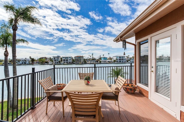 wooden deck with a water view