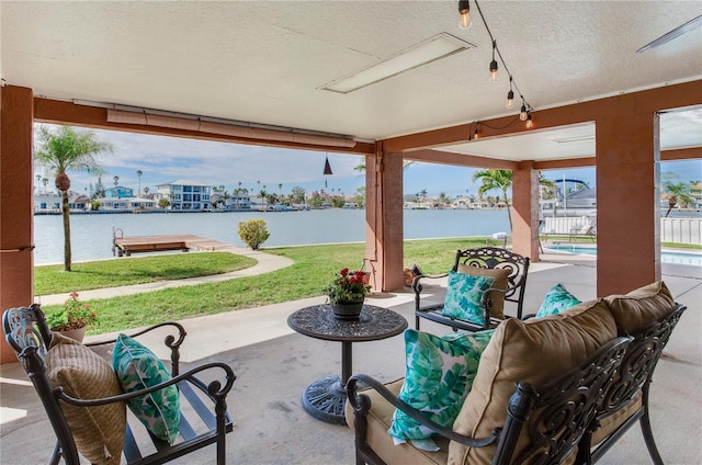 view of patio / terrace featuring a water view