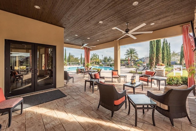 view of patio featuring french doors and ceiling fan