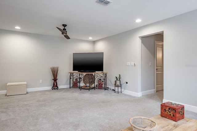 interior space with carpet flooring and ceiling fan