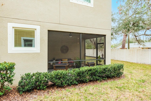 entrance to property with a lawn