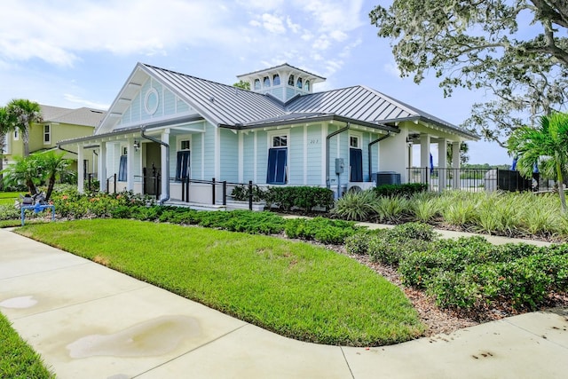 view of front of home featuring covered porch and a front lawn