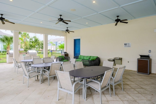 view of patio with area for grilling and ceiling fan