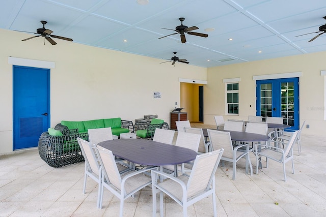 view of patio / terrace with ceiling fan and an outdoor living space