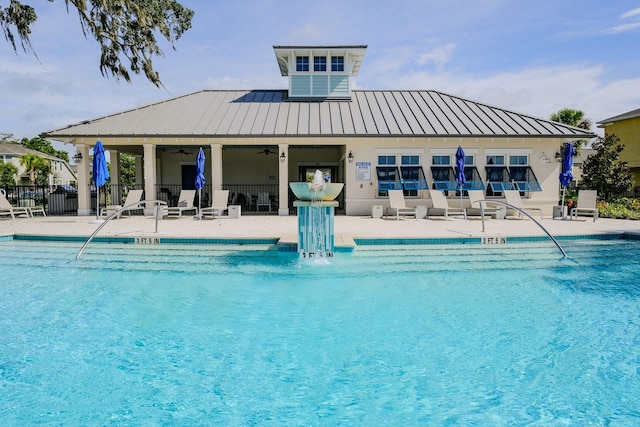 view of pool with ceiling fan and a patio area