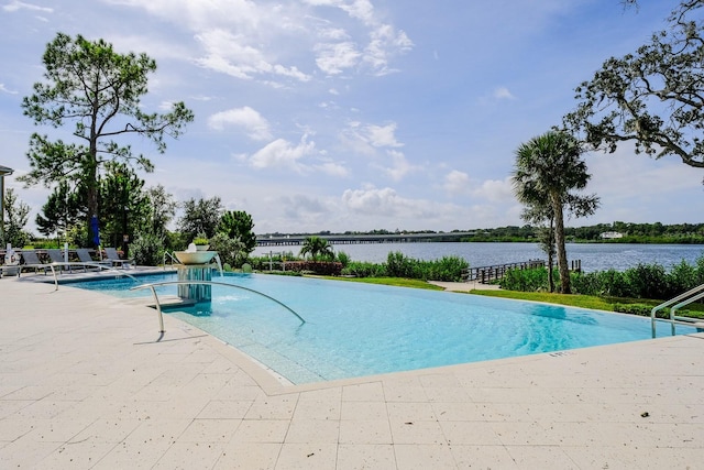 view of pool featuring a water view