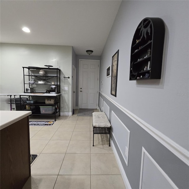 hallway featuring light tile patterned floors