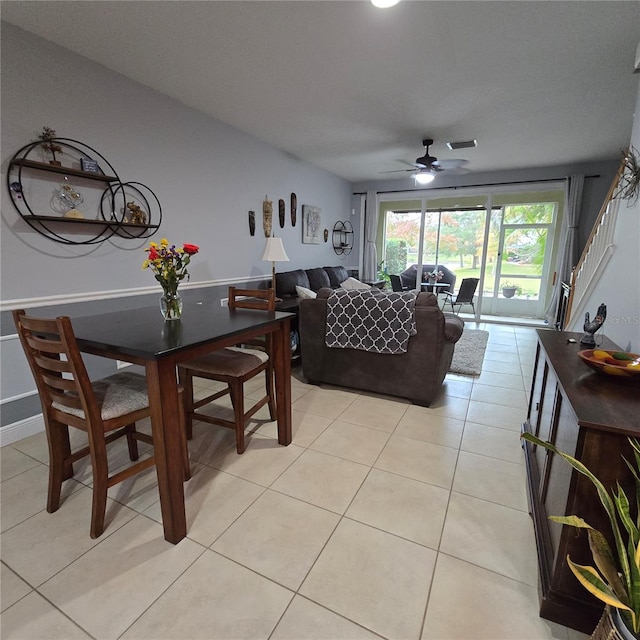 tiled living room with ceiling fan