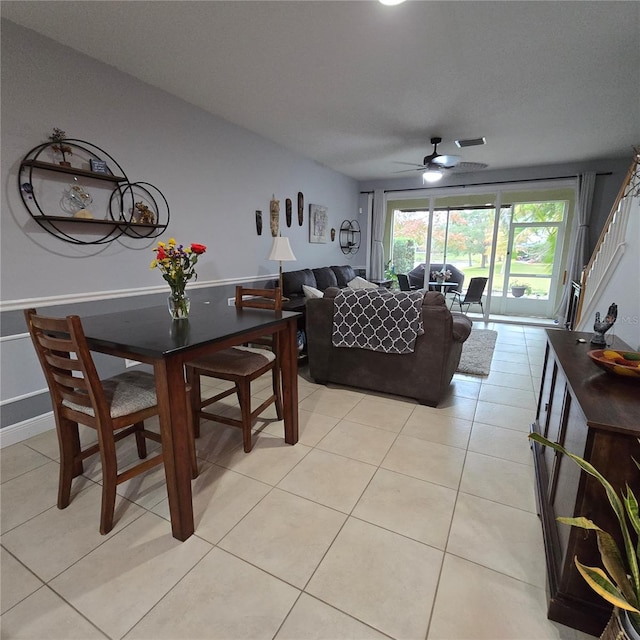 tiled living room with ceiling fan