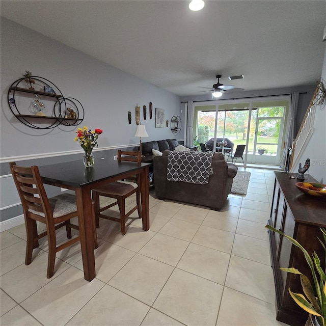 living room with ceiling fan and light tile patterned floors