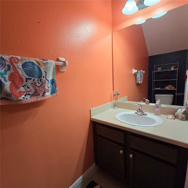 bathroom with vanity and toilet