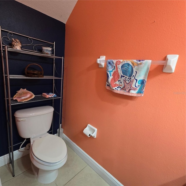 bathroom featuring toilet and tile patterned floors