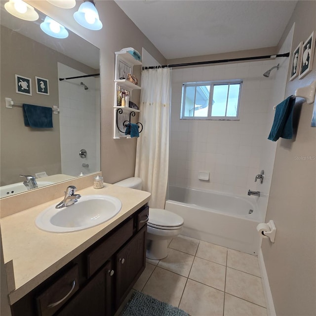 full bathroom featuring toilet, vanity, tile patterned floors, and shower / bath combo with shower curtain