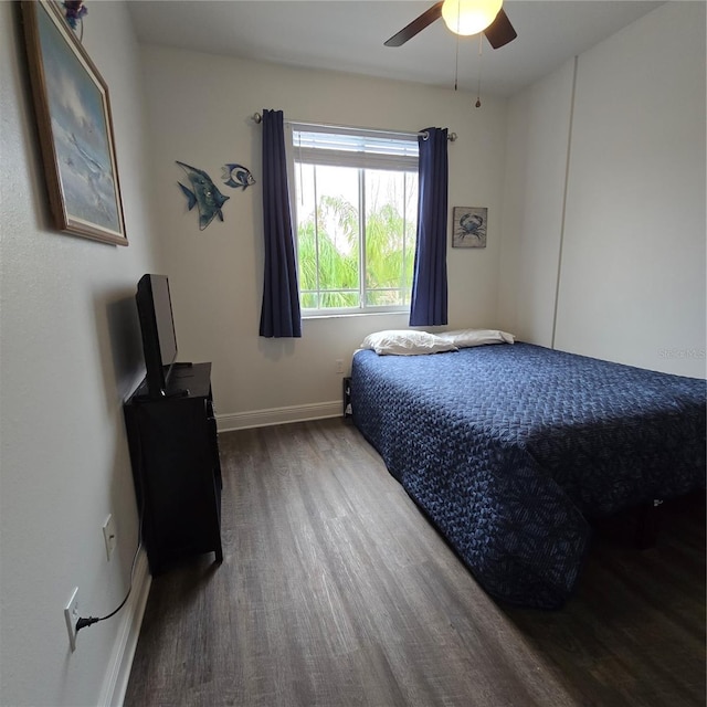 bedroom featuring ceiling fan and hardwood / wood-style flooring