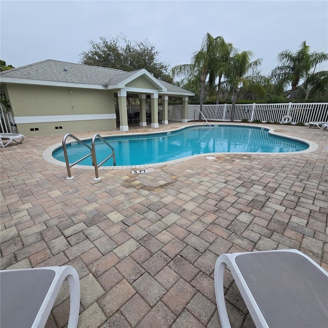 view of swimming pool featuring a patio